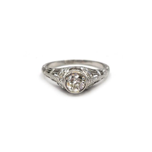 Platinum art deco diamond ring with intricate design and sparkling diamonds, unbranded jewelry piece.