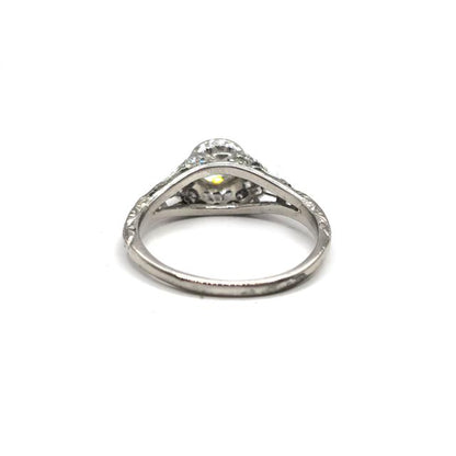 Platinum Art Deco diamond ring with intricate geometric design and sparkling diamonds, showcasing elegant craftsmanship.