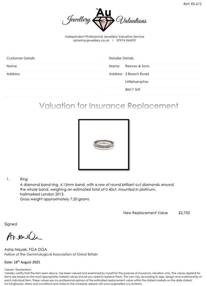 Platinum diamond ring with a central sparkling diamond, unbranded jewelry piece with intricate band detail.