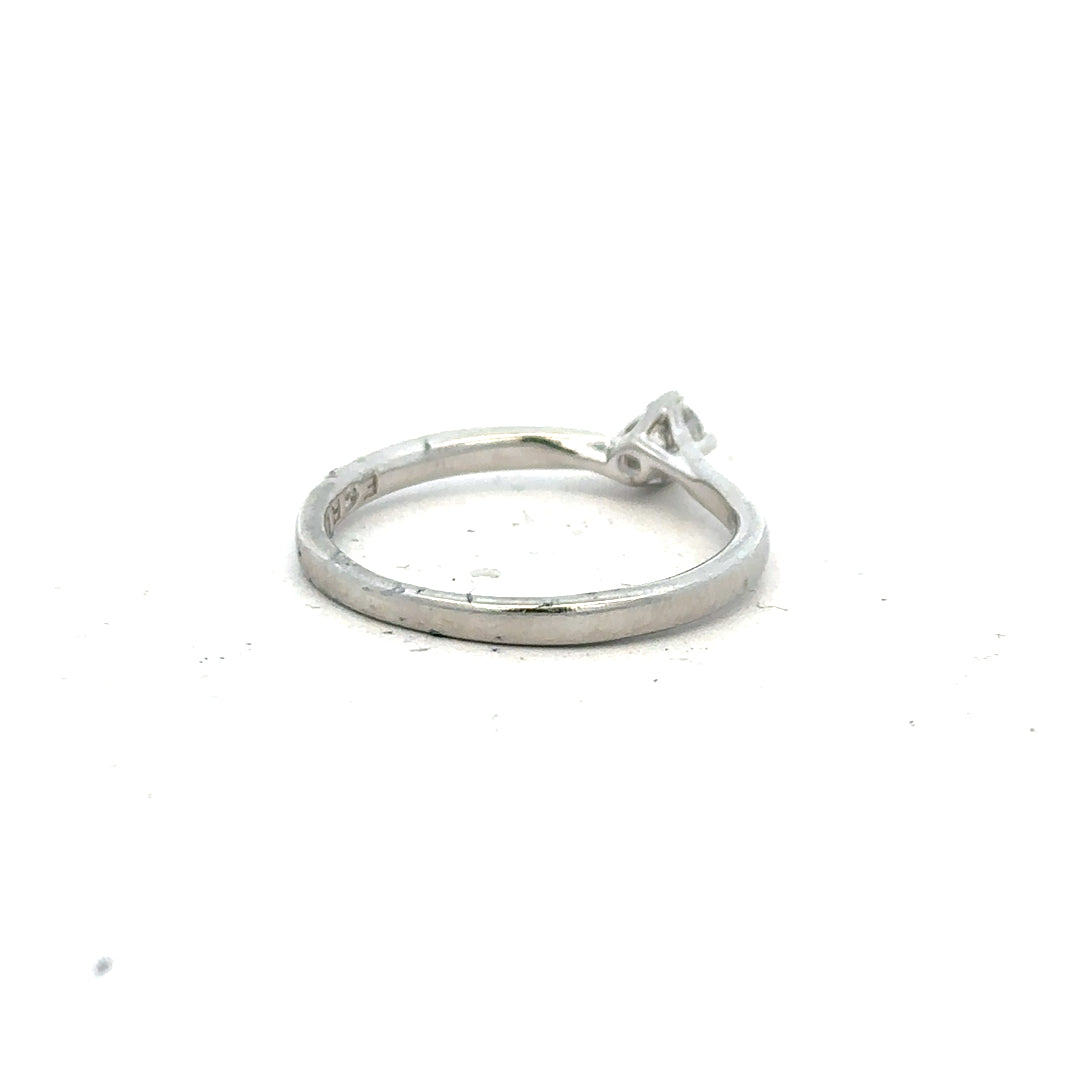 Platinum diamond ring with box set, size small, featuring a sparkling diamond mounted on a sleek platinum band.