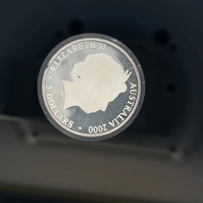 Silver 2000 Olympic coin, 31.4g, unbranded, collectible silver coin featuring Olympic imagery and design.