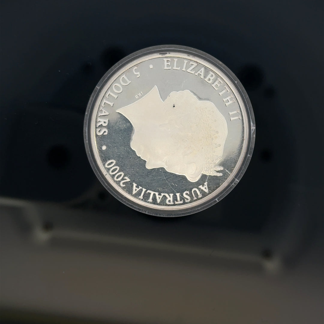 Silver 2000 Olympic coin, 31.4g, unbranded, featuring Olympic design, detailed image of the collectible silver coin.