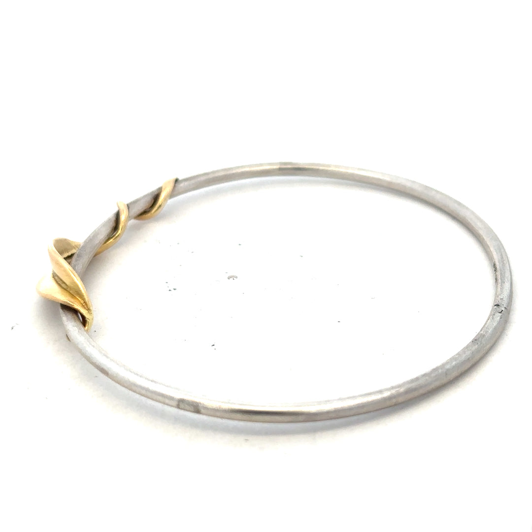 Silver bracelet bangle weighing 13.3g, unbranded, with a smooth, shiny finish and simple circular design.