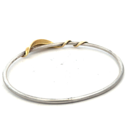 Silver bangle bracelet weighing 13.3g with a smooth, polished finish, perfect for everyday wear or special occasions.