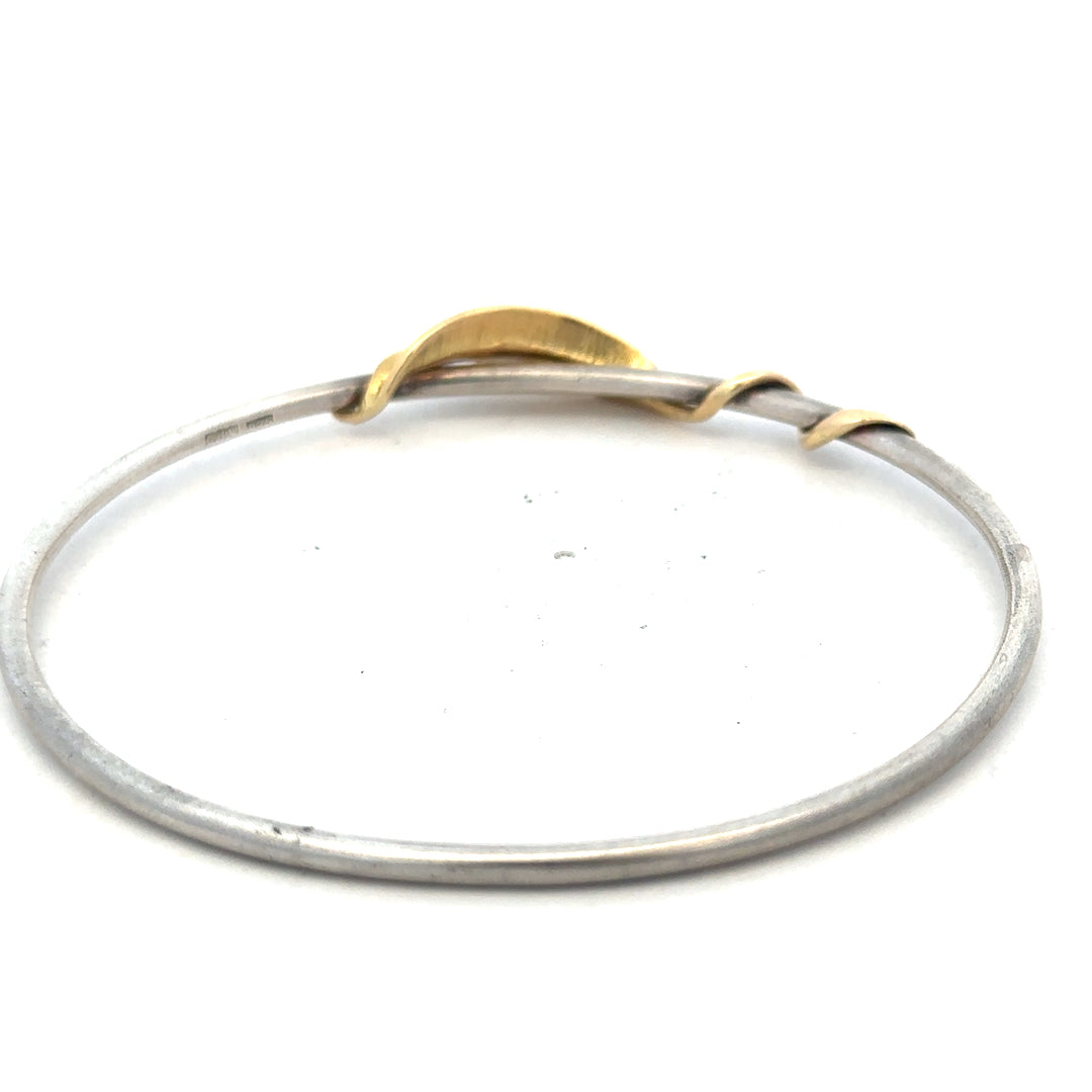 Silver bangle bracelet weighing 13.3g, unbranded, with a smooth, polished finish and rounded design.