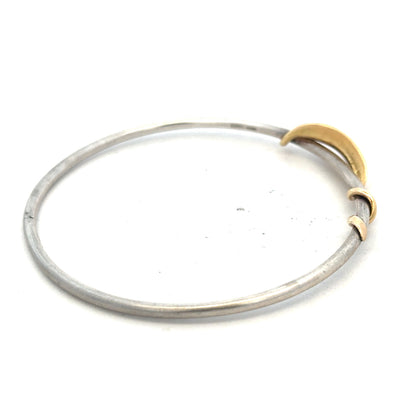 Silver bracelet with a smooth, polished finish, weighing 13.3g, showcasing a stylish unbranded bangle on a neutral background.