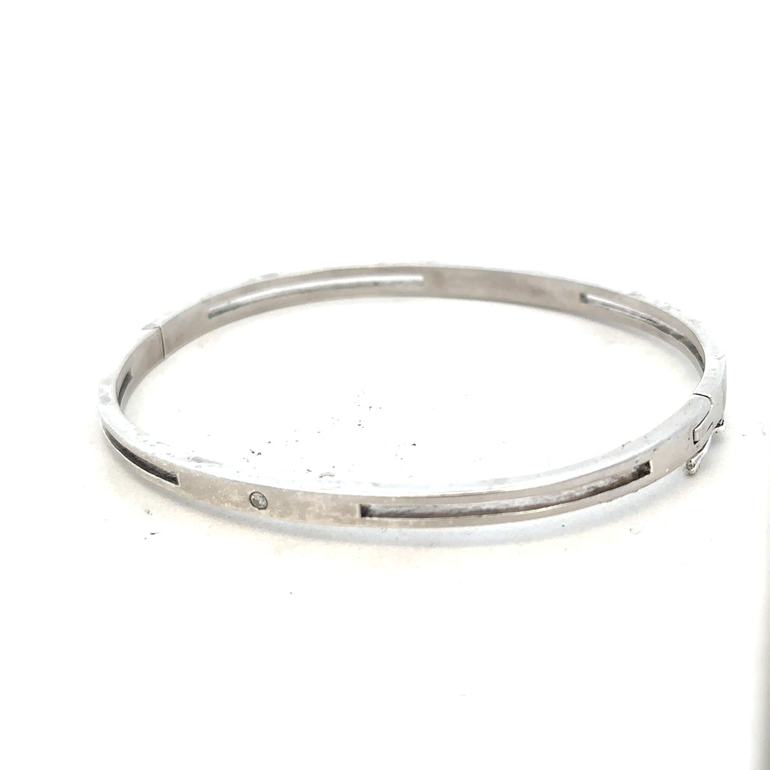 Silver bangle bracelet weighing 13.5g, unbranded, with a smooth, polished finish and rounded design.