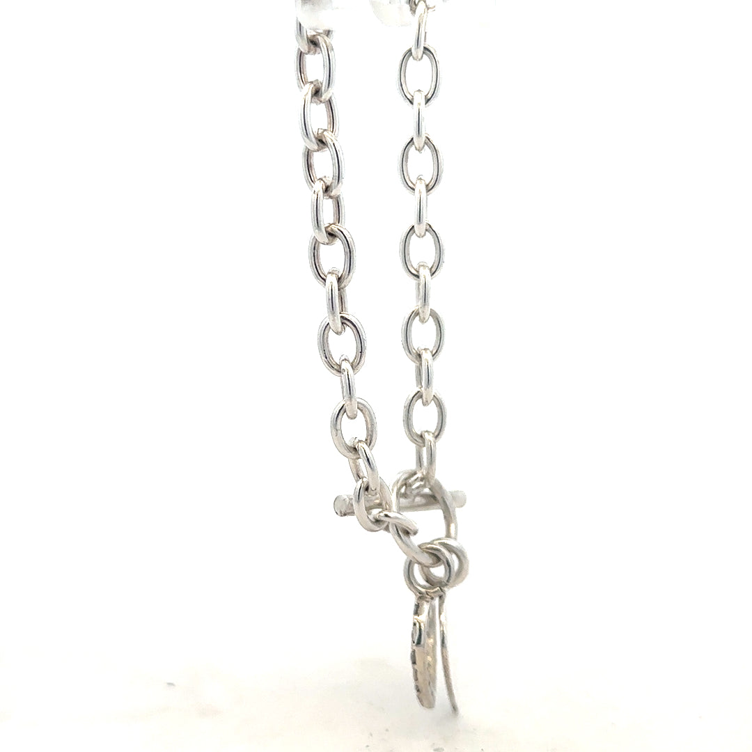 Silver bracelet weighing 19.5g, featuring a sleek design, unbranded jewelry piece displayed on a neutral background.