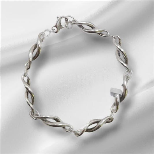 Silver bracelet, 19cm length and 14.4g weight, displayed on a neutral background, showcasing its sleek, metallic design.