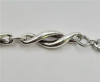 Silver bracelet measuring 19cm, weighing 14.4g, featuring a sleek unbranded design with a polished finish.