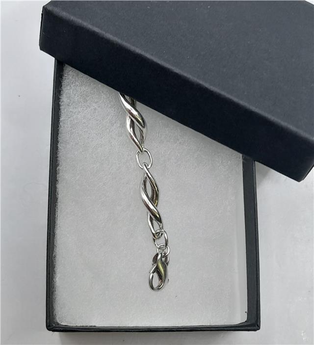 Silver bracelet, 19cm length and 14.4g weight, unbranded jewelry with a sleek design.