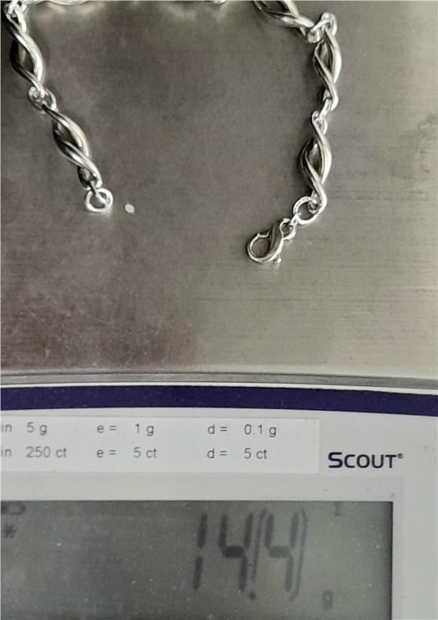 Silver bracelet 19cm, 14.4g, unbranded, with a sleek, polished design, shown on a neutral background.