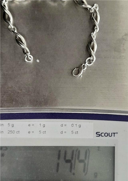 Silver bracelet 19cm, 14.4g, unbranded, with a sleek, polished design, shown on a neutral background.