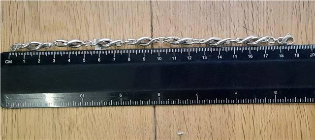 Silver bracelet, 19cm length, lightweight 14.4g, unbranded jewelry piece with a sleek, polished design.