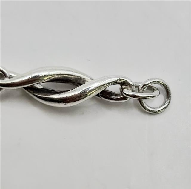 Silver bracelet measuring 19cm and 14.4g, featuring a simple unbranded design with a polished finish.