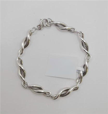 Silver bracelet, 19cm length and 14.4g weight, unbranded jewelry accessory with a sleek, polished design.