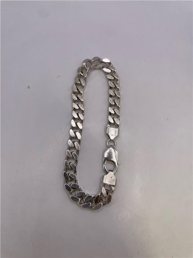 Silver bracelet weighing 33.8g with a sleek design, featuring a shiny finish and unbranded style, shown on a neutral background.