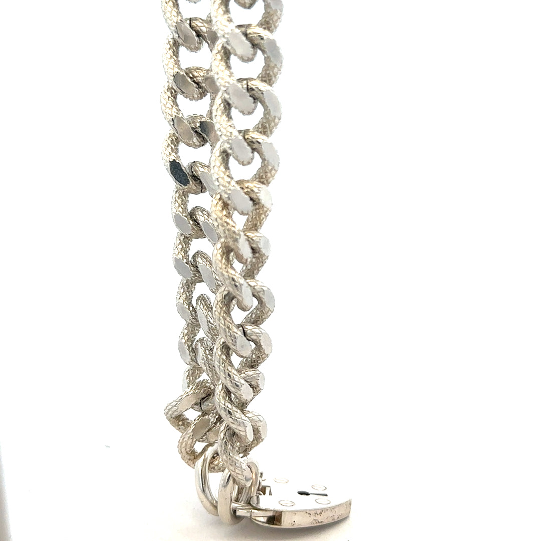 Silver bracelet weighing 64.4g with intricate design, crafted for elegant jewelry styling.