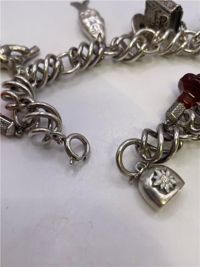 Silver bracelet weighing 73.5g with a sleek design, displayed on a neutral background.