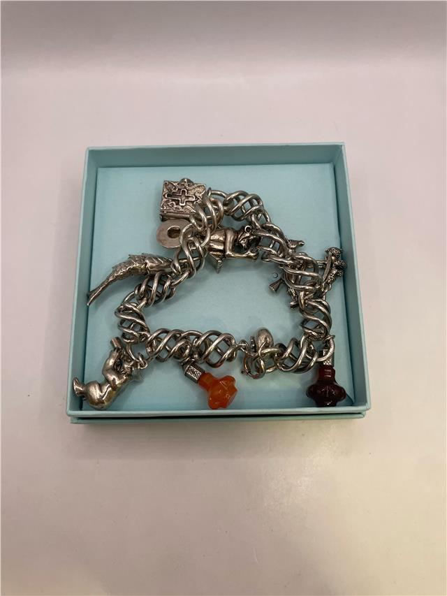 Silver bracelet weighing 73.5 grams, featuring a sleek design, displayed on a neutral background.