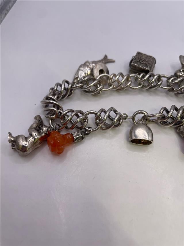 Silver bracelet weighing 73.5g with a sleek, polished design, featuring the unbranded bracelet style in the image.