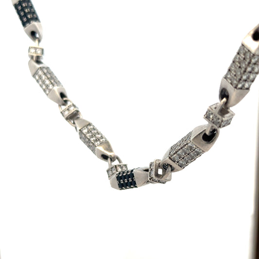 Silver chain weighing 113.4g, unbranded jewelry chain, detailed close-up showing its links and metallic shine.
