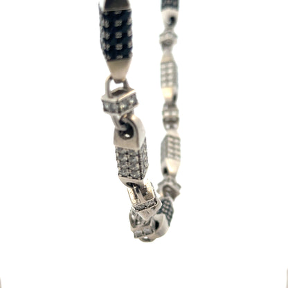 Silver chain weighing 113.4g, displayed on a plain background, showcasing its shiny, linked design and unbranded construction.