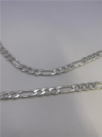 Silver chain weighing 31.5g, unbranded, showcasing its length and intricate link design against a neutral background.