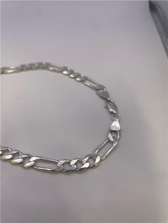 Silver chain weighing 31.5g, unbranded jewelry chain with intricate links, suitable for necklaces or accessories.