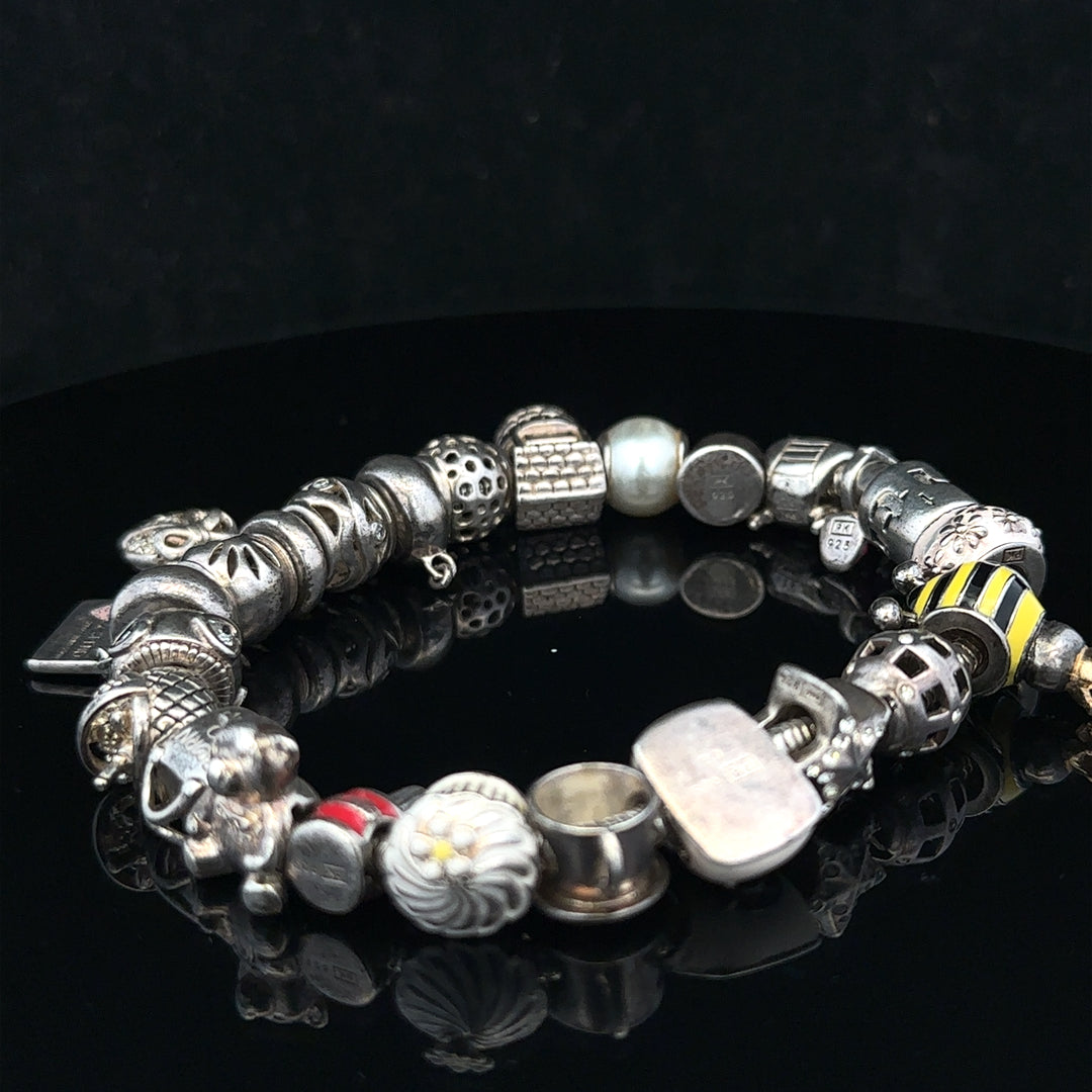 Silver charm bracelet with delicate charms, 64.8 cm length, unbranded jewelry accessory for stylish wear