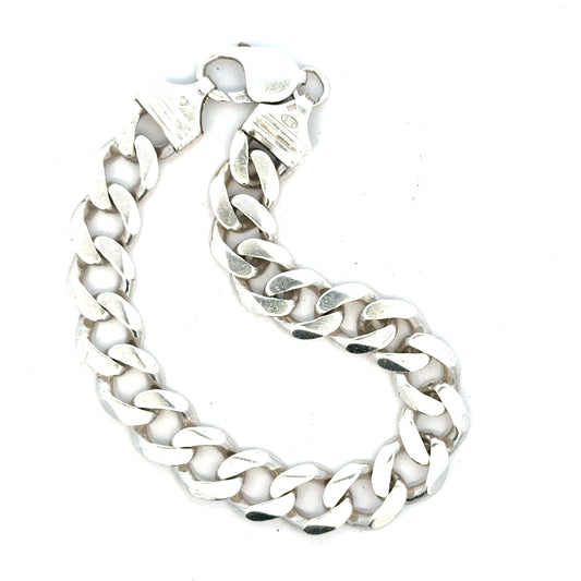 Silver curb bracelet weighing 33.7g with a classic chain design, unbranded jewelry accessory for everyday wear.