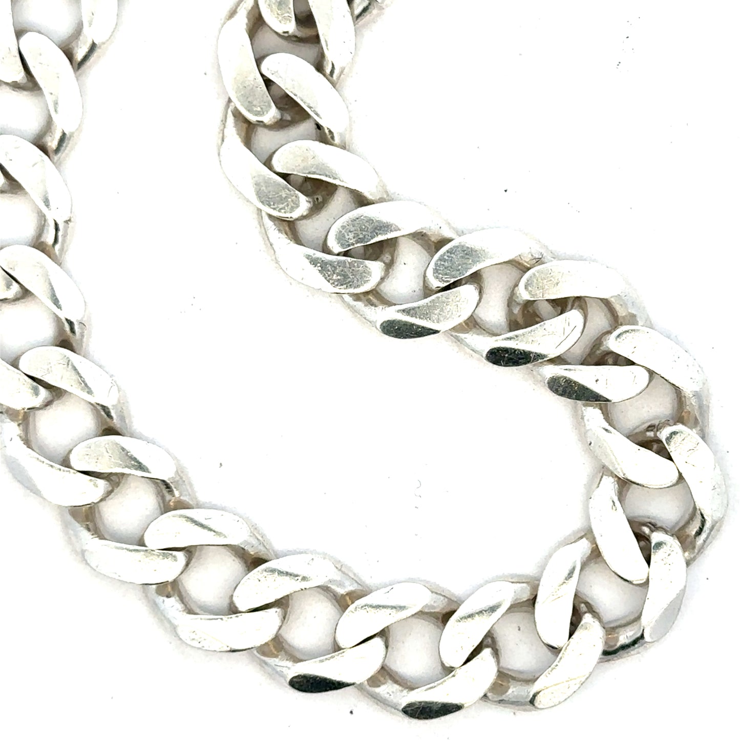 Silver curb bracelet weighing 33.7g with a sleek chain design, unbranded jewelry accessory for both men and women.