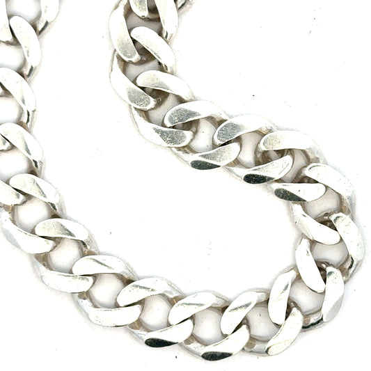 Silver curb bracelet weighing 33.7g with a sleek chain design, unbranded jewelry accessory for both men and women.