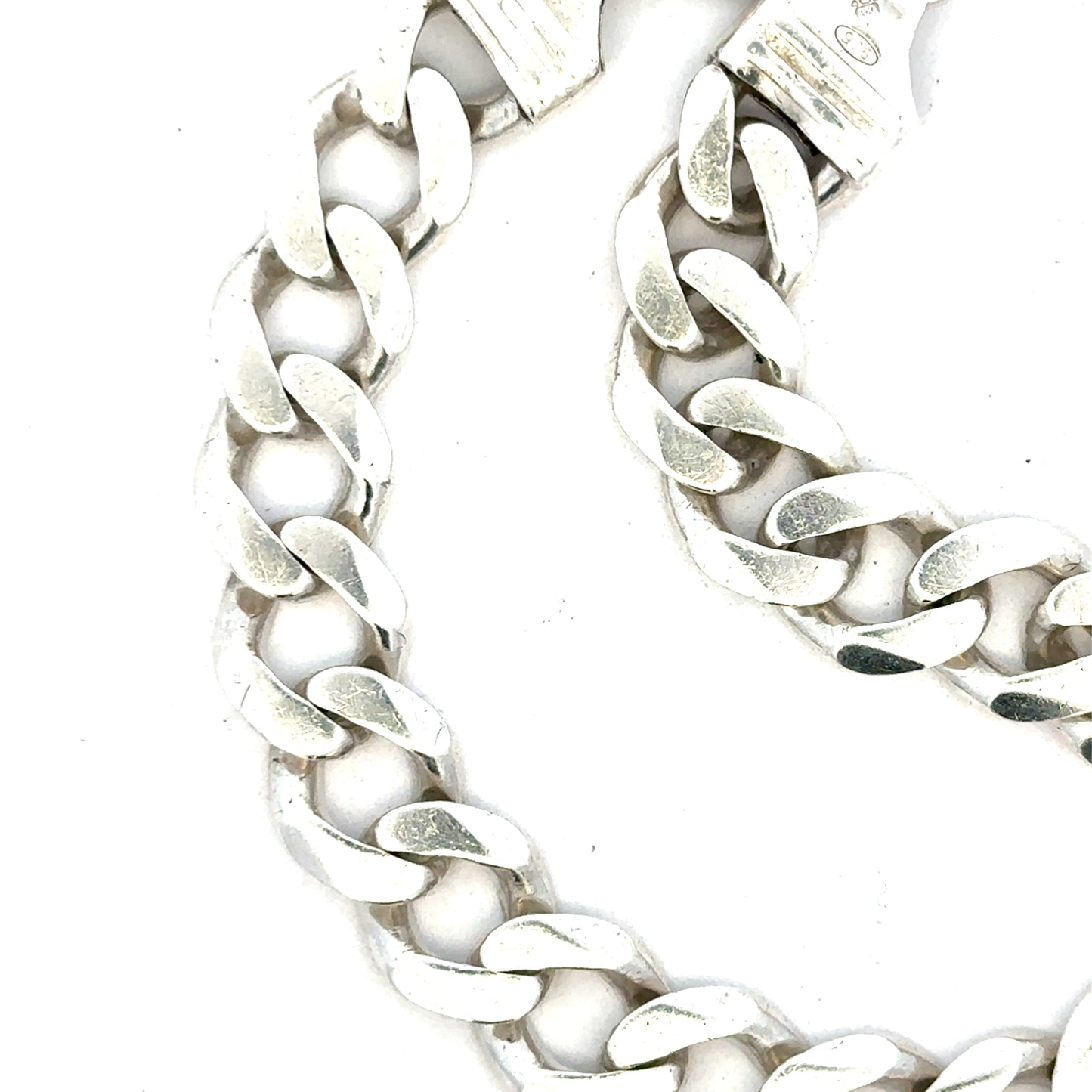 Silver curb bracelet weighing 33.7g, unbranded, with a sleek, polished chain design shown in the image.