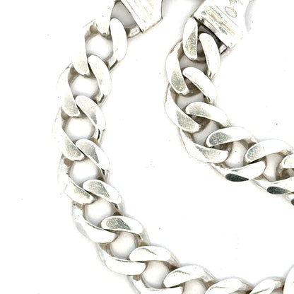 Silver curb bracelet weighing 33.7g, unbranded, with a sleek, polished chain design shown in the image.