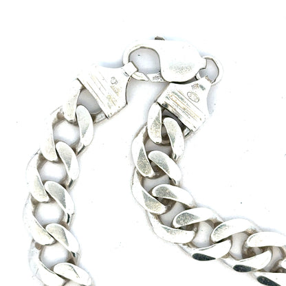 Silver curb bracelet weighing 33.7g, unbranded jewelry piece with a sleek, durable chain design.