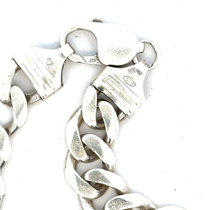 Silver curb bracelet weighing 33.7g, unbranded jewelry piece with a sleek, linked chain design.