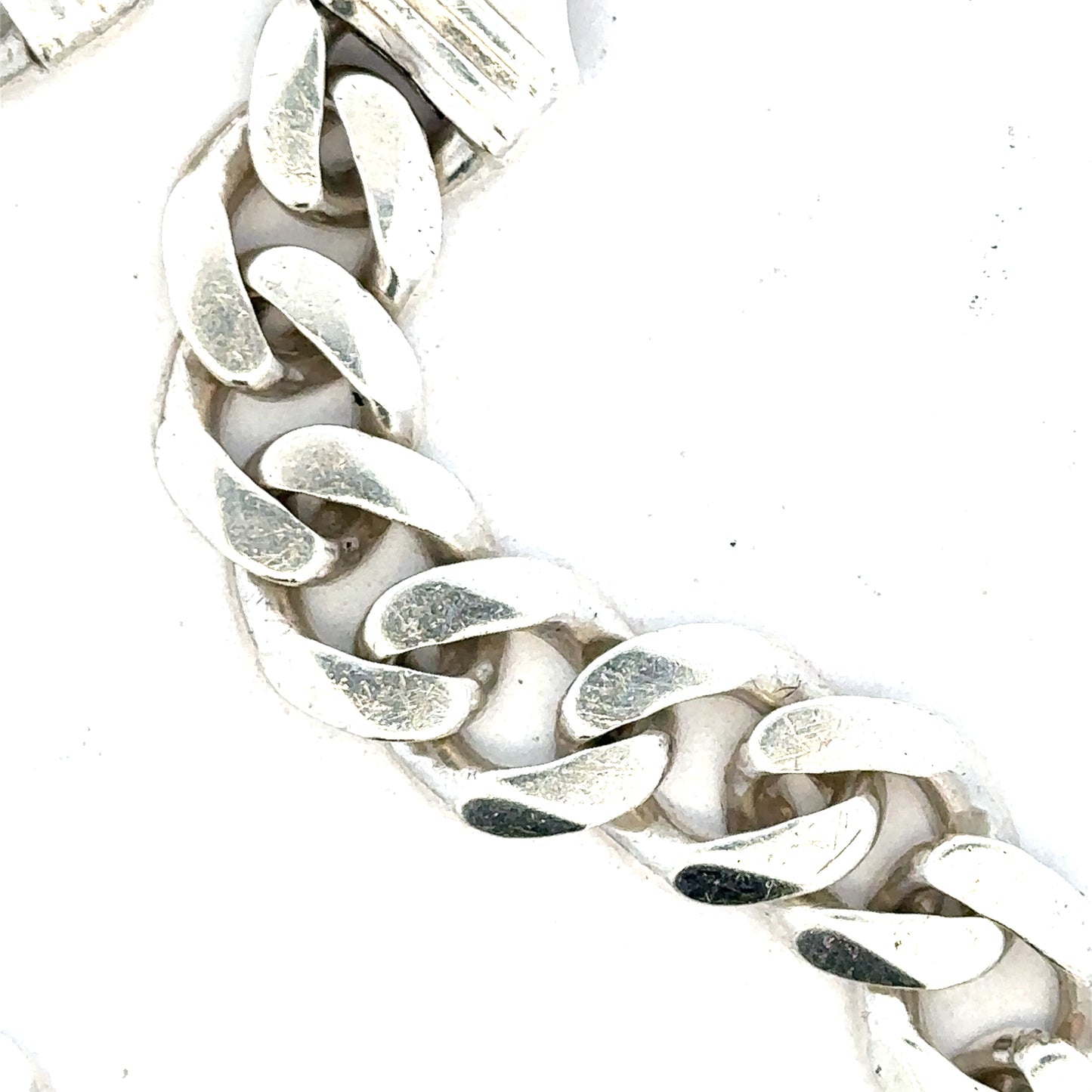 Silver curb bracelet weighing 33.7g with a sleek chain design, unbranded jewelry accessory, displayed on a neutral background.