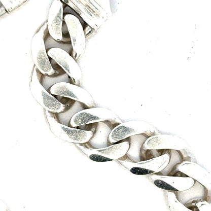 Silver curb bracelet weighing 33.7g with a sleek chain design, unbranded jewelry accessory, displayed on a neutral background.