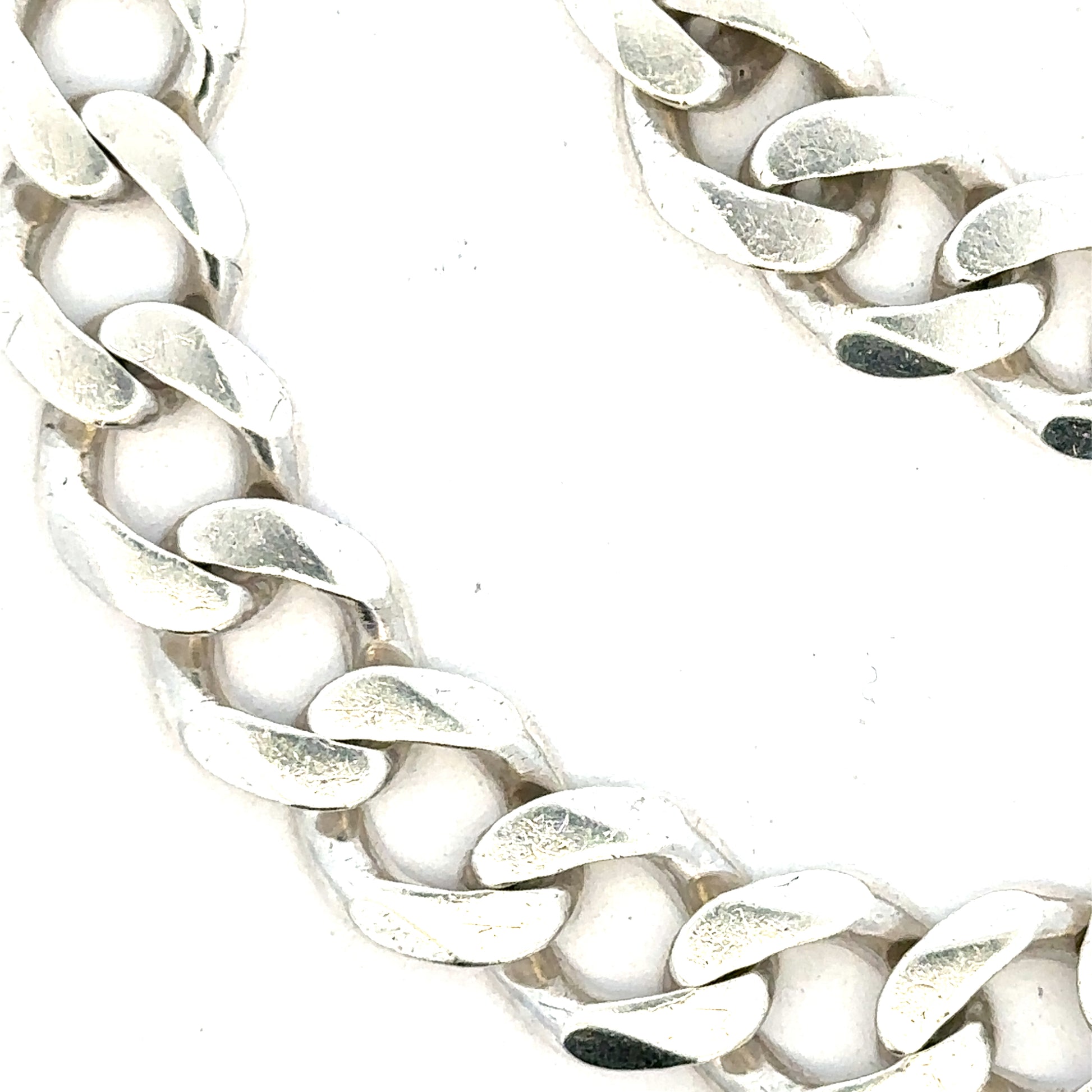 Silver curb bracelet weighing 33.7g, featuring classic chain links, unbranded jewelry accessory for stylish wear.