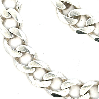 Silver curb bracelet weighing 33.7g, featuring classic chain links, unbranded jewelry accessory for stylish wear.