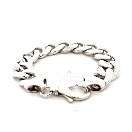 Silver curb bracelet weighing 90.1g with a sleek chain design, unbranded jewelry accessory.