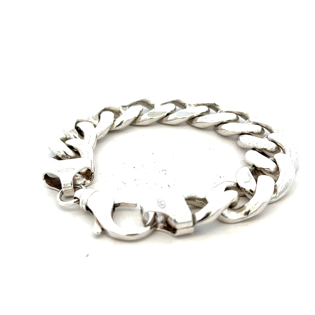 Silver curb bracelet weighing 90.1g with a sleek chain design, unbranded jewelry accessory for everyday wear.