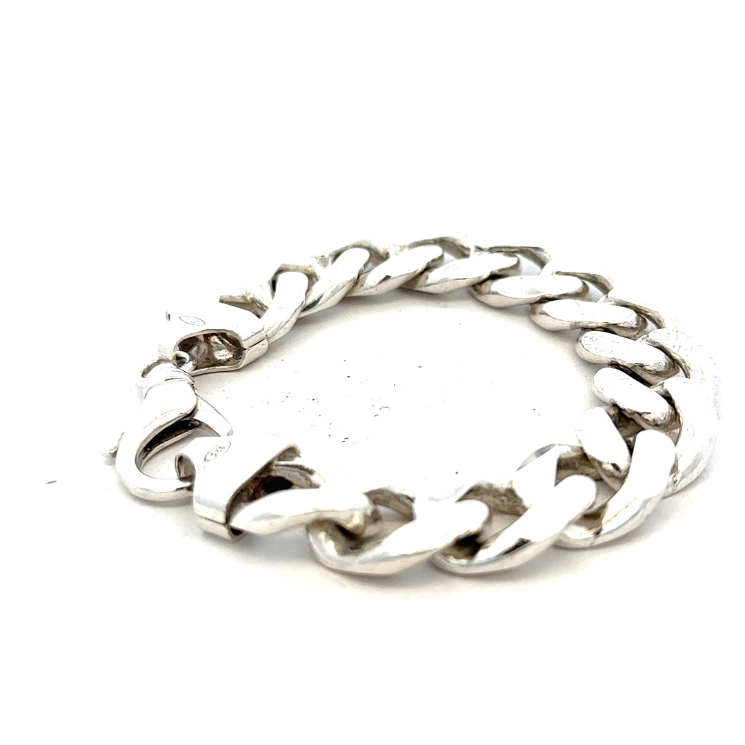 Silver curb bracelet weighing 90.1g, featuring interlinked flat links, crafted from polished silver, unbranded jewelry accessory.
