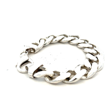 Silver curb bracelet weighing 90.1g, featuring interlinked flat links, crafted from polished silver, unbranded jewelry accessory.