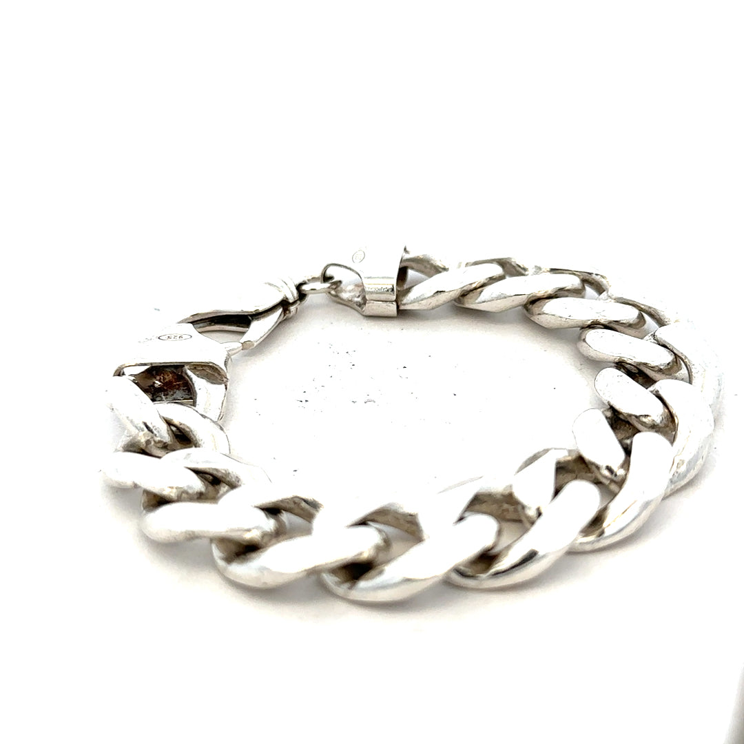 Silver curb bracelet weighing 90.1g with a sleek chain design, unbranded jewelry piece on a plain background.