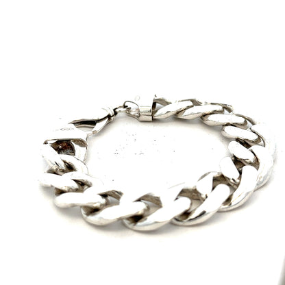 Silver curb bracelet weighing 90.1g with a sleek chain design, unbranded jewelry piece on a plain background.