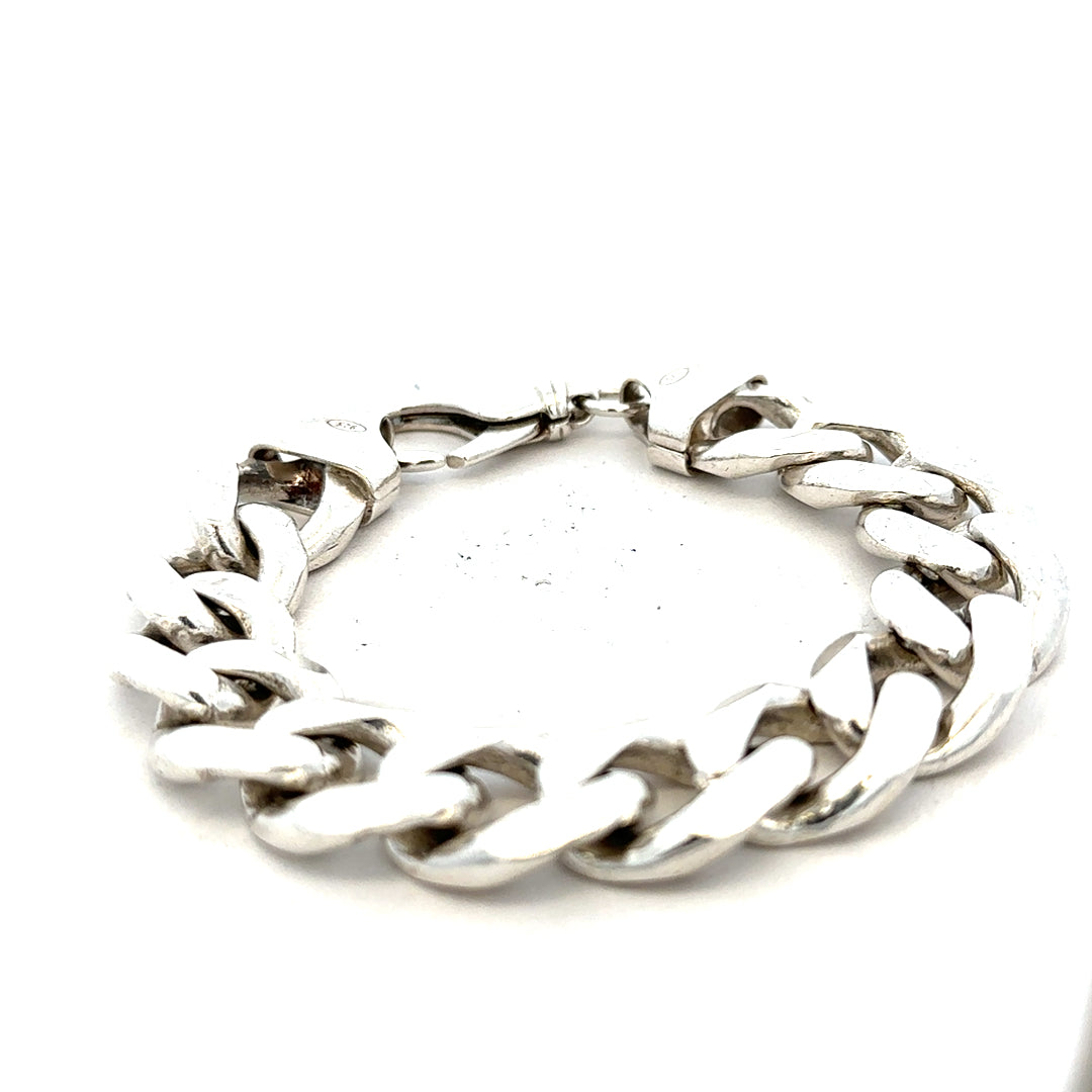 Silver curb bracelet weighing 90.1g with linked chain design, unbranded jewelry accessory shown in the image.