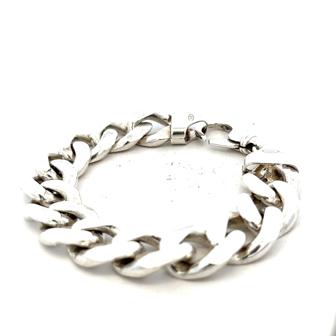 Silver curb bracelet weighing 90.1g with a sleek, interconnected chain design, unbranded jewelry accessory.