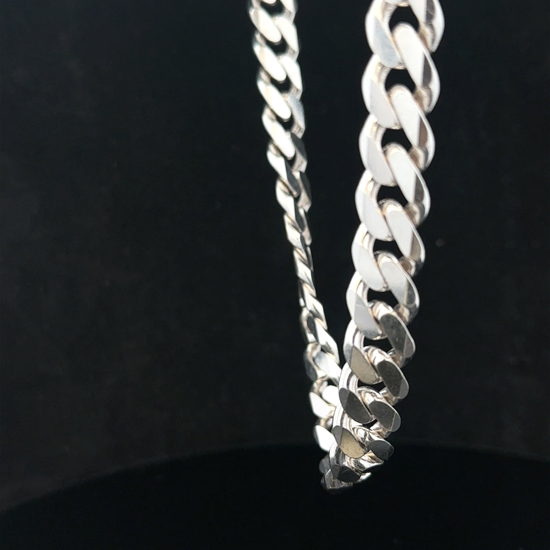 Silver curb chain weighing 109.9g, unbranded jewelry chain with a classic curb link design, displayed against a neutral background.